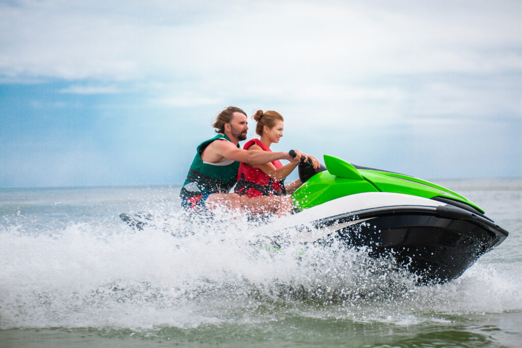 couple having fun on water scooter summer sea activity